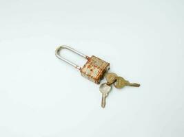 Rusty lock and rusty keys on white background photo