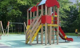 Shaded kid's playground activity tower equipment photo