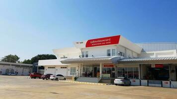 Ubon Ratchathani, Thailand-May 12, 2023 Ubon Ratchathani mail center or Post Office building with blue sky background. The place for service people shipping parcel, send letter or mail and purchase. photo