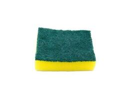 New green and yellow sponge for washing dishes isolated on white background. Object for cleaning dishware, utensils and kitchen photo