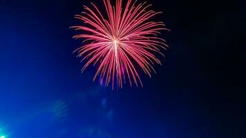 fireworks celebration over the temple in the dark sky photo