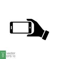 Hand holding phone icon. Simple solid style. Hand hold cell phone, smartphone device, technology concept. Black silhouette, glyph symbol. Vector illustration isolated on white background. EPS 10.