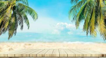 Top of wood balcony table with seascape and palm leaves, sea and sky at beach photo