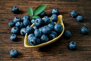 Blueberry fruit on the old wooden floor photo