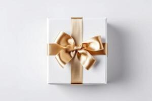 Gift box with satin ribbon and bow on white background photo