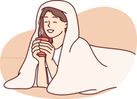 Girl with cup of hot coffee lies wrapped in blanket and smiles enjoying winter morning png