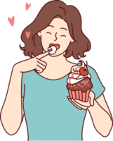 Woman eats delicious cupcake, licking sweet cream from finger and enjoying appetizing dessert png