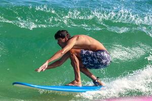 Rio de Janeiro, RJ, Brazil, 05.08.2023 - Surfers riding waves on Arpoador Beach, Ipanema photo