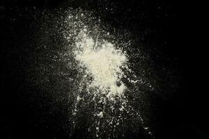 Splash of white powder isolated photo