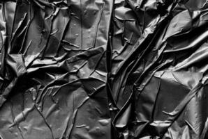 glued black plastic texture background photo