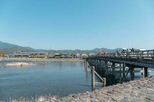 Togetsukyo Bridge in Arashiyama district, Kyoto, Japan in spring photo