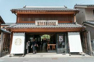 KAWAGOE, JAPAN - APRIL 11, 2023 View of Starbucks storefront at Kanetsuki Street photo