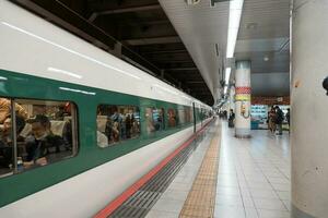 TOKYO, JAPAN - APRIL 10, 2023 E5 series shinkansen on a Yamabiko service to Sendai at Ueno station. photo