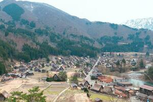 SHIRAKAWA, JAPAN - APRIL 5, 2023 Aerial view of Shirakawa-go village in springtime photo