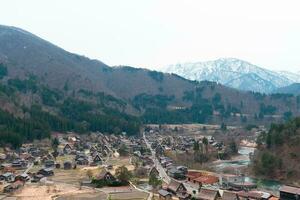 SHIRAKAWA, JAPAN - APRIL 5, 2023 Aerial view of Shirakawa-go village in springtime photo