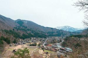 SHIRAKAWA, JAPAN - APRIL 5, 2023 Aerial view of Shirakawa-go village in springtime photo