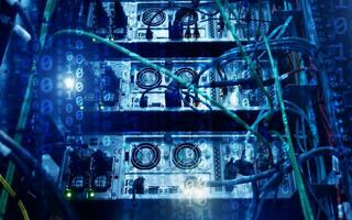 Binary code matrix digital internet technology concept on server room background. photo