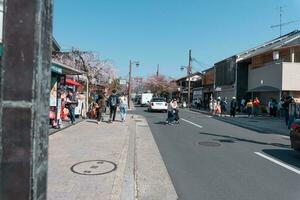 KYOTO, JAPAN - April 4, 2023 Tourist walking at Arashiyama district photo