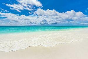 Seascape. Sea sand sky concept. Beach and ocean as a background. Beautiful sandy beach and soft blue ocean waves over coral reef. Summer mood and vibes photo