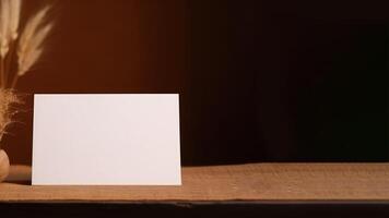 Blank White Invitation Card Mockup and Closeup Dried Grass Pot Decoration on Burlap Cover Table. . photo