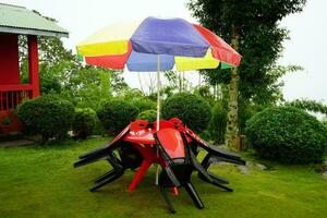 Red Chair table and Umbrella for Sitting Arrangement at Lungchok East Sikkim photo