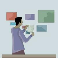 vector a man pastes colorful paper on the wall flat design