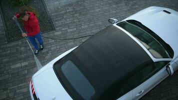 Men Pressure Washing His Brand New Cabriolet Car. video