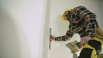 Construction Worker Patching Apartment Walls video