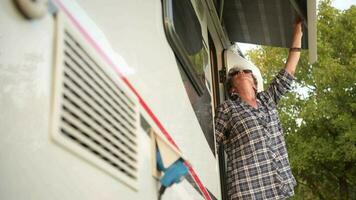 Caucasian Retired Woman in Her 60s Checking Her RV Camper Van Awning. video