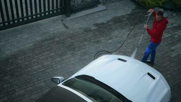 Caucasian Men in His 30s Washing His White Cabrio Vehicle Using Pressure Washer. video