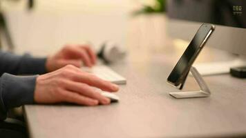 Men Working in Front of His Smartphone and Desktop Computer video