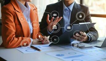 Co working team meeting concept,business with smart phone and laptop and digital tablet computer in office with virtual interface icons photo