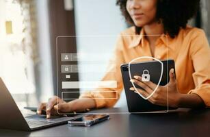 Cyber security concept, Login, User, identification information security and encryption, secure access to user's personal information woman using smart phone and tablet in office photo