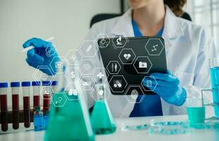 Dctor work on digital tablet healthcare doctor technology tablet using computer  in laboratory study with VR icon photo