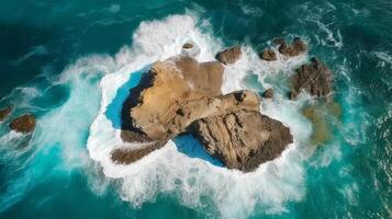 Airborne see. Colossal boulder inside parts the ocean.Sheersetting coast. photo