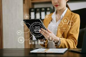 Businesswoman working virtual tablet computer twith reduce CO2 concept with icons, global warming such as reforest green factory recycle photo