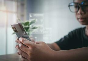 A boy's hand uses a smartphone to type live chat, ask, answer with an artificial intelligence system. chat bot. Ai. photo