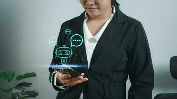Businesswoman hand uses a smartphone to type live chat, ask, answer with an artificial intelligence system. chat bot. Ai. photo