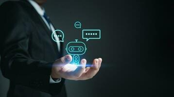 Chatbot. Ai. Robot. Businessman in suit holding a virtual model of artificial Intelligence. Using artificial Intelligence helps to work more efficiently. photo