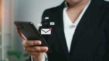 Businessman checking email on mobile phone. New email notification ideas for business email communication and digital marketing. The inbox receives electronic message notifications. photo