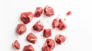 Raw beef meat on white background. Top view. Copy space. photo