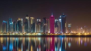 Amazing Panoramic View of Qatar Skyline Reflecting in the Water During Night Time. Technology. photo