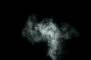 Abstract  powder or smoke isolated on black background photo