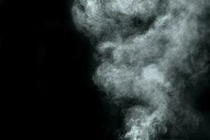 Abstract  powder or smoke isolated on black background photo