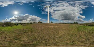 full seamless spherical 360 hdri panorama view near huge windmill propeller in equirectangular projection, VR AR virtual reality content. Wind power generation. Pure green energy. photo