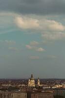 The view of Budapest with the illuminated Szent cathedral under the blue sky during the afternoon photo