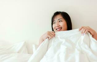 Wake up happy in the morning in bed Enough rest, full sleep, and a smile full of happiness. happy bedroom photo