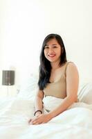 Wake up happy in the morning in bed Enough rest, full sleep, and a smile full of happiness. happy bedroom photo