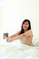 Wake up happy in the morning in bed Enough rest, full sleep, and a smile full of happiness. happy bedroom photo