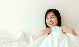 Wake up happy in the morning in bed Enough rest, full sleep, and a smile full of happiness. happy bedroom photo